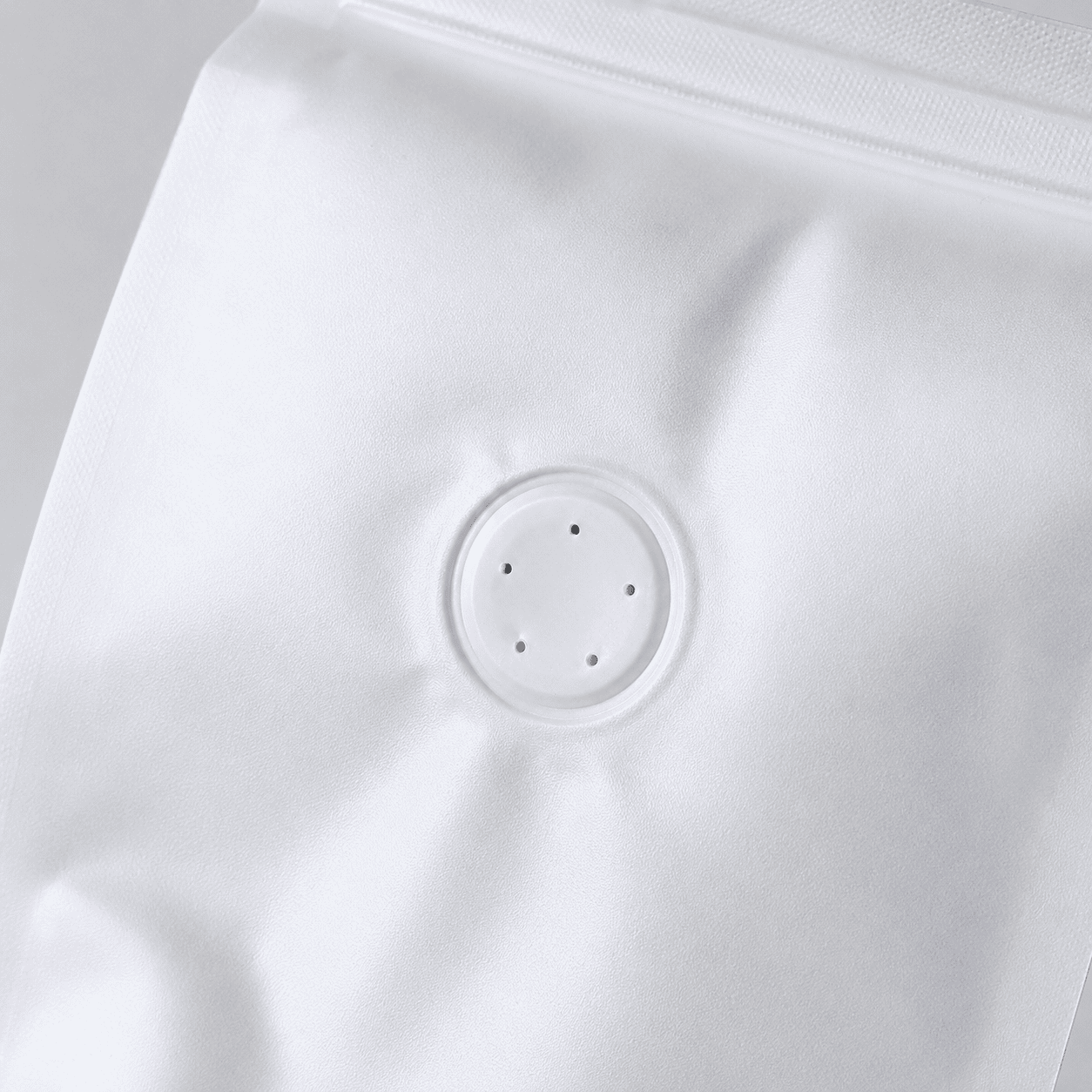One-way degassing valve detail on coffee packaging pouch