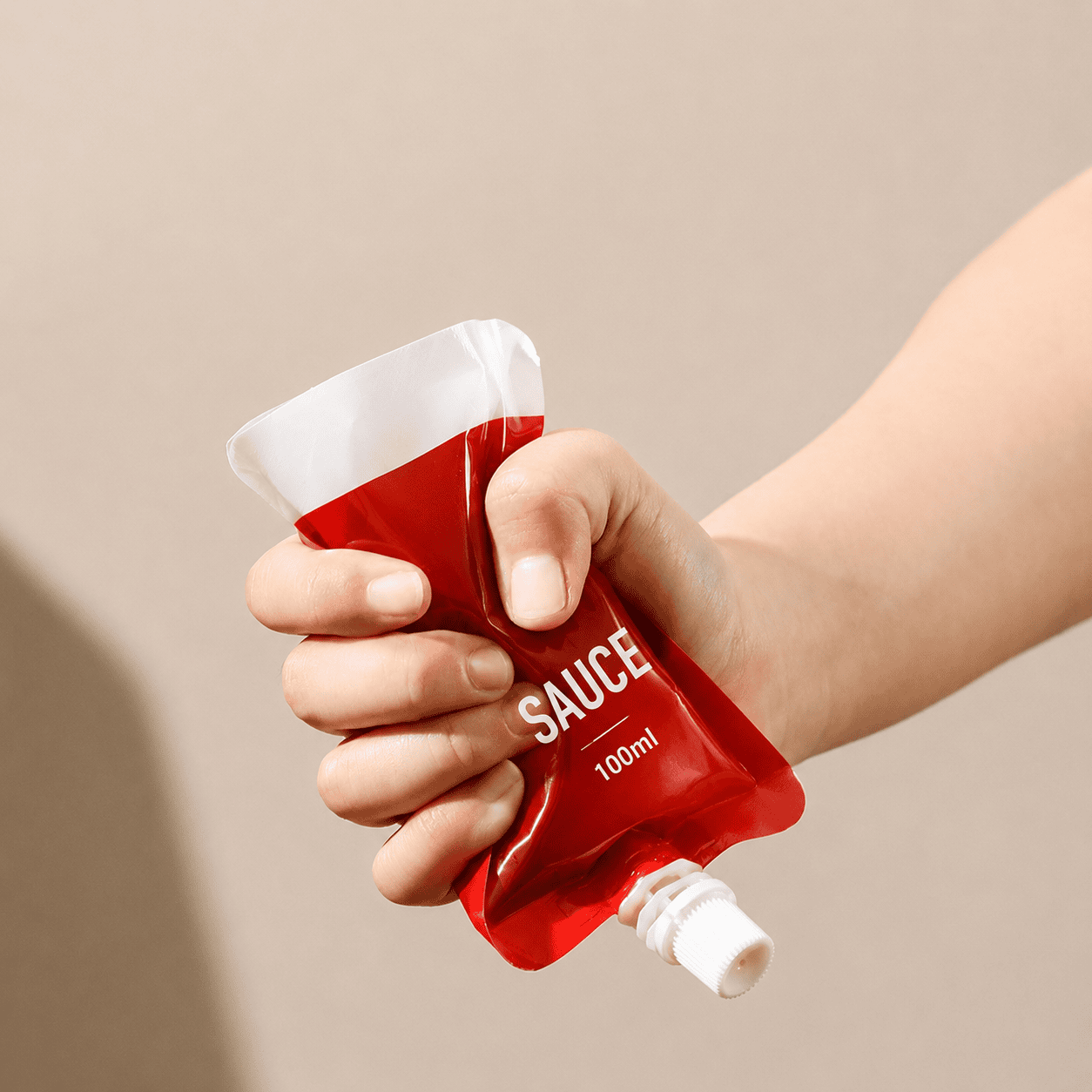 Sauce Spout Pouch in Use Squeezable sauce spout pouch in use