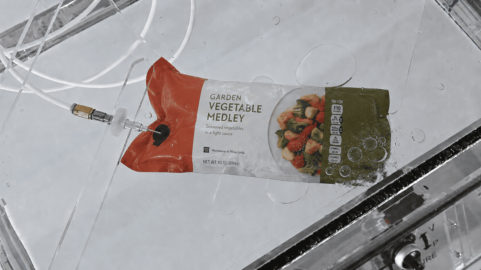 Frozen food pouch undergoing a leak test to check seal integrity