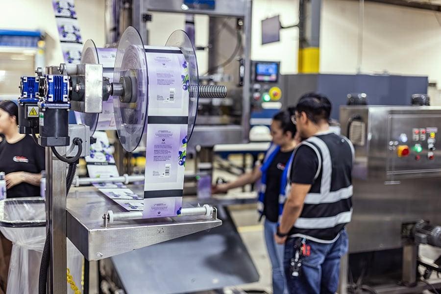 Printed rollstock film on a flexible packaging production line for pillow pouch packaging