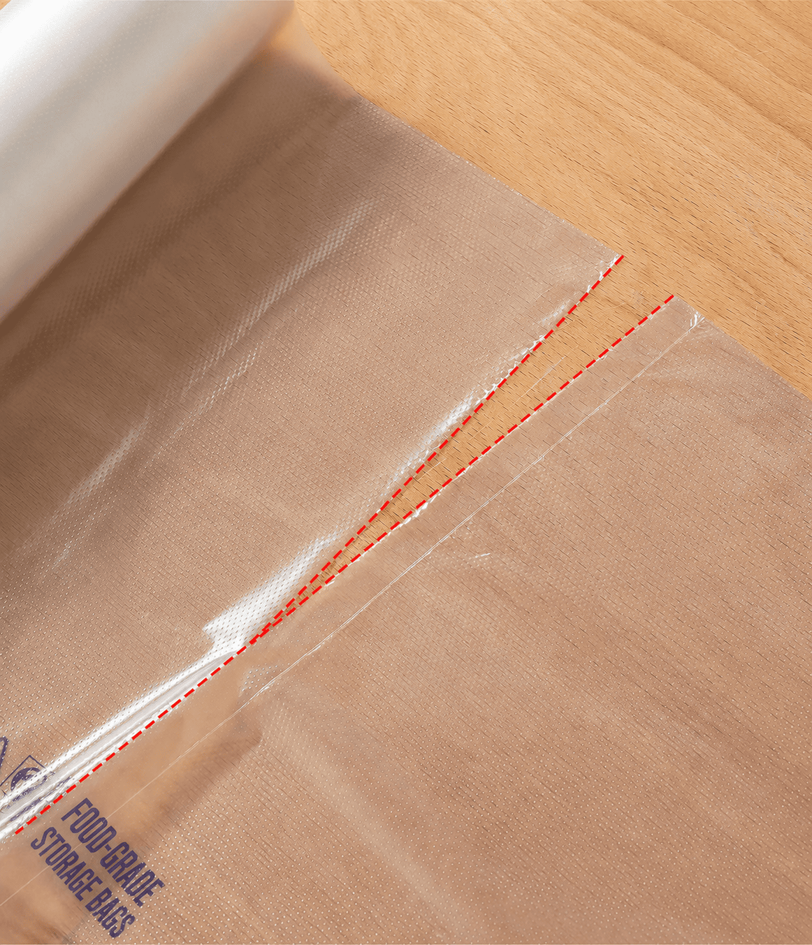 Perforation Line on Perforated Roll Bags Close-up of a perforation line connecting clear flat perforated roll bags.