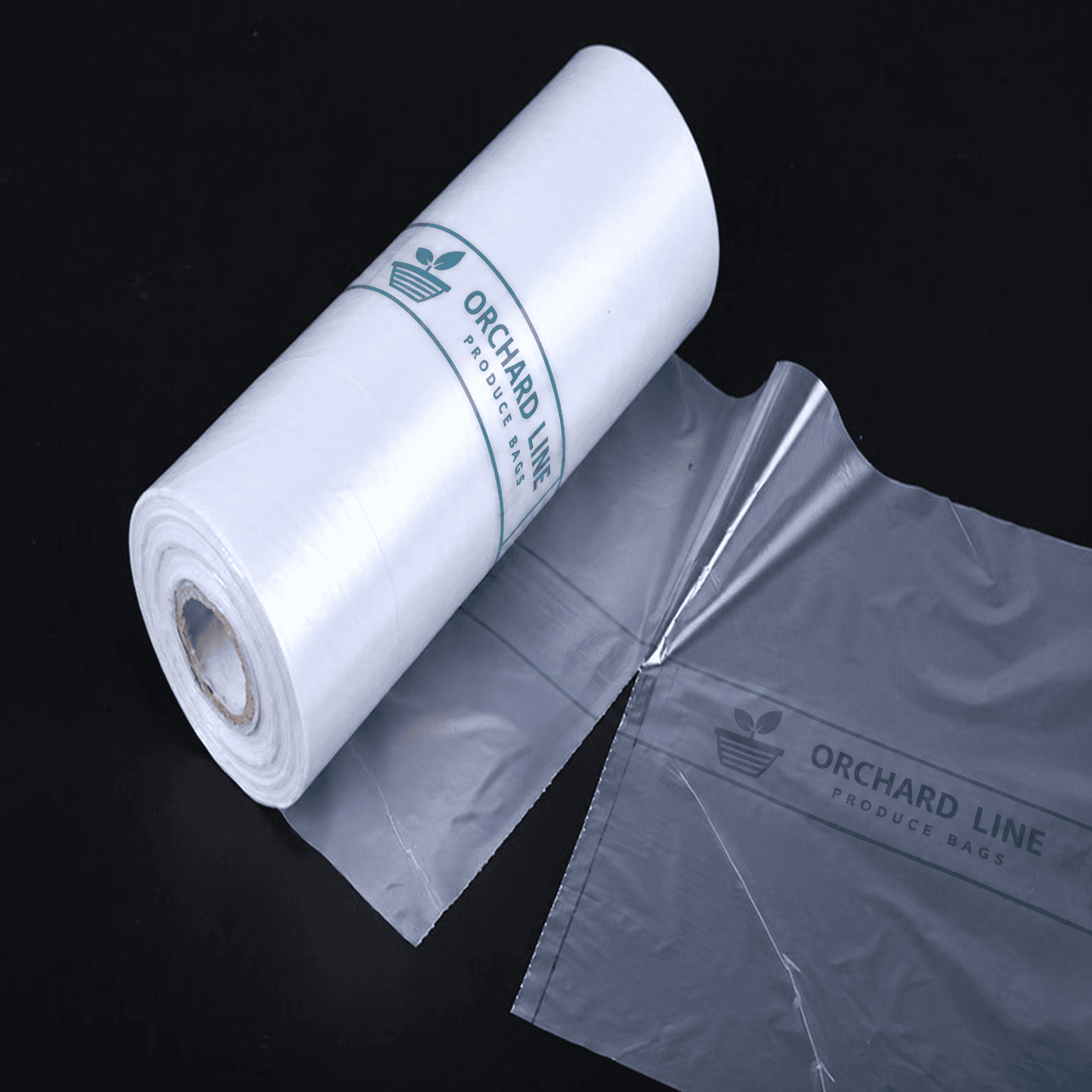 Custom printed produce roll bags with green branding on clear film